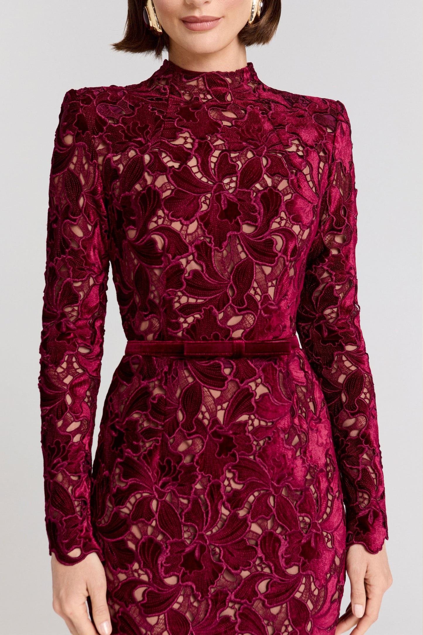 Burgundy lace high neckline detail with intricate floral pattern