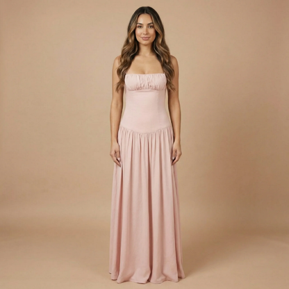 Blush pink ruched maxi dress with fitted bodice and spaghetti straps for women