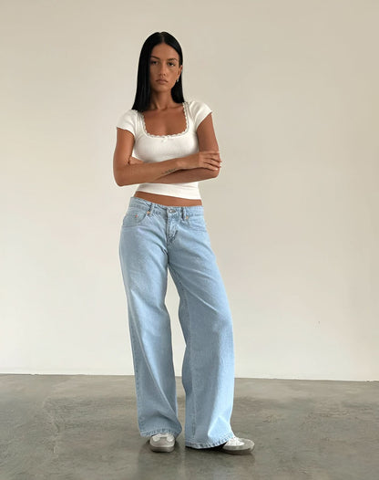 Pale blue wide leg jeans with relaxed fit and vintage wash