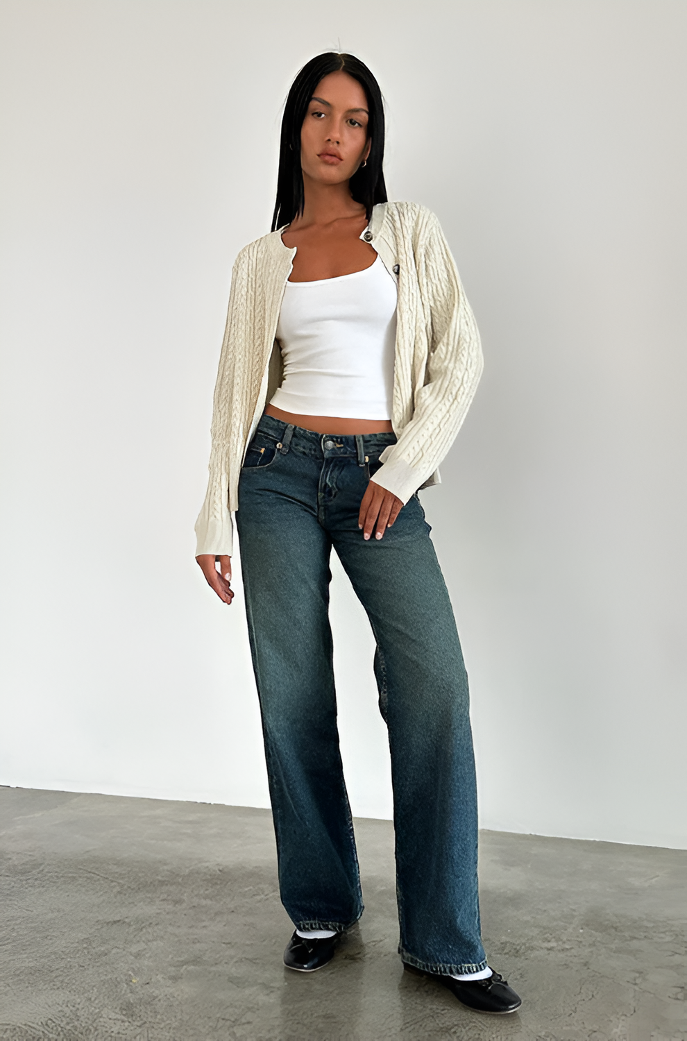 Dark teal wide leg jeans with relaxed fit and raw hem