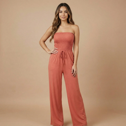 Coral smocked strapless jumpsuit with drawstring waist and wide-leg pants