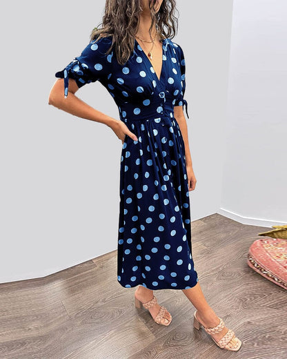 Navy blue wrap midi dress with light blue polka dot print