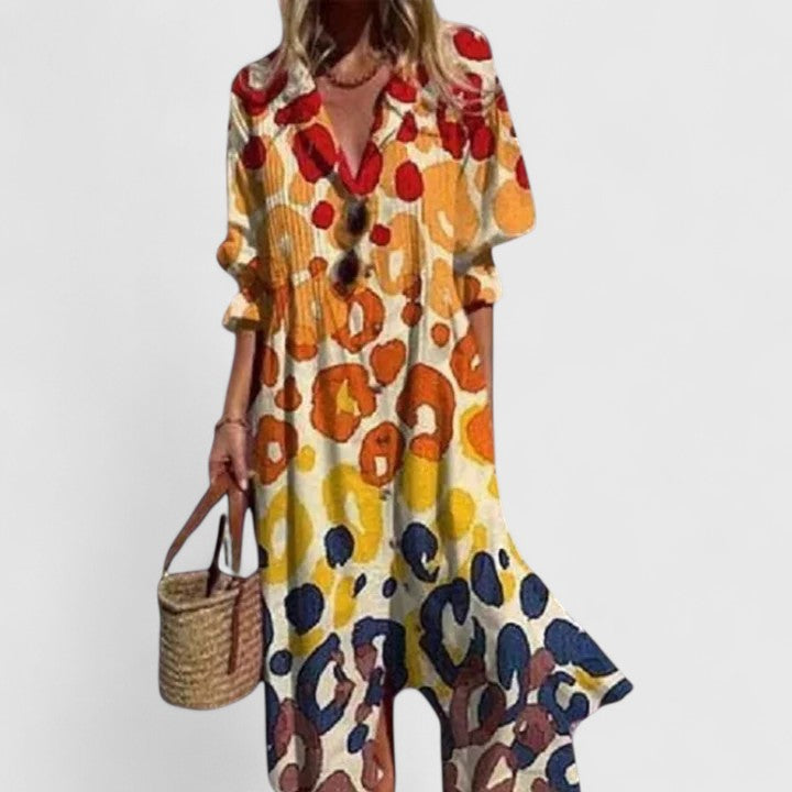 Maxi dress with red, orange, and navy floral pattern and button details