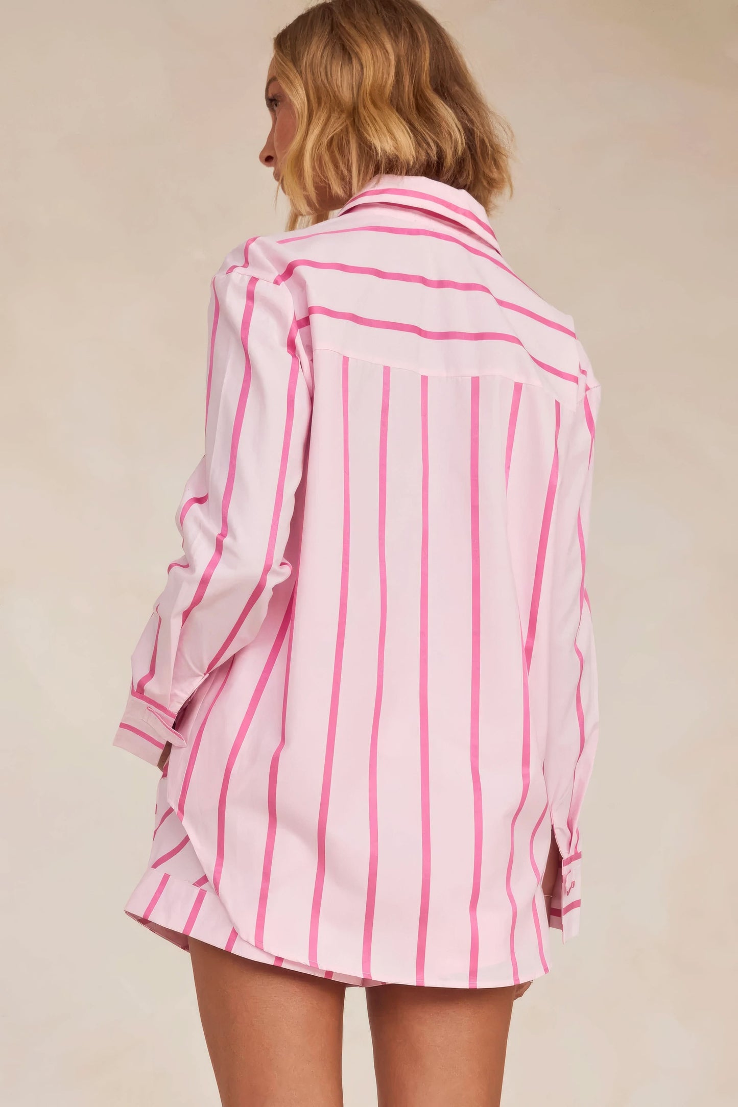 Rear detail of pink and white striped shirt with vertical and horizontal lines