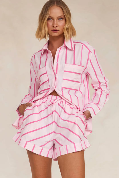 Pink and white striped button-up shirt with matching pleated shorts set