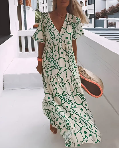 Green and cream floral maxi dress with short sleeves and V-neckline