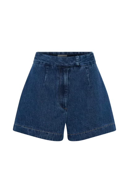 Flat lay of blue denim shorts showing waistband and hem construction