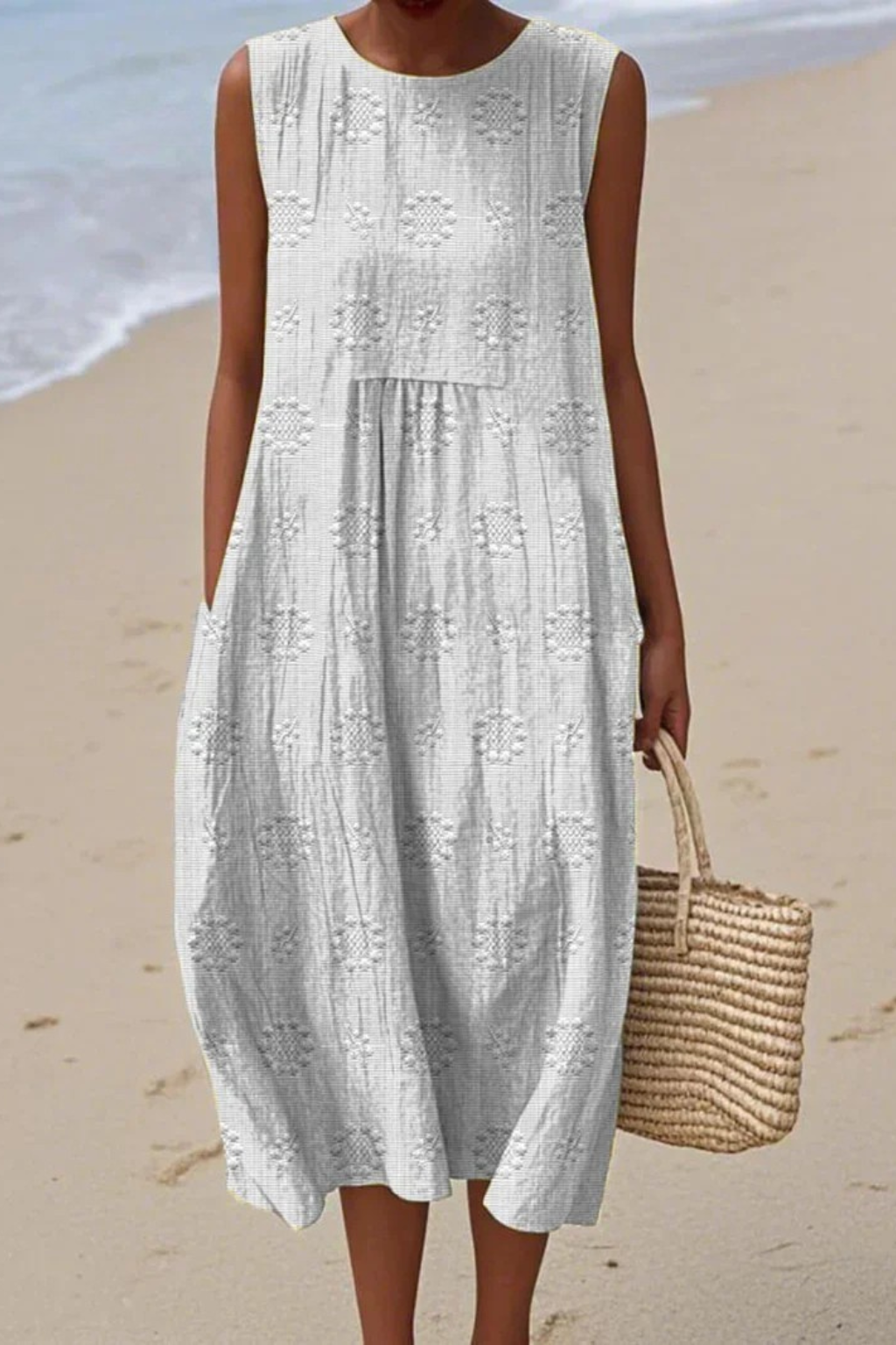 White embroidery midi dress with raised geometric motifs and relaxed fit silhouette