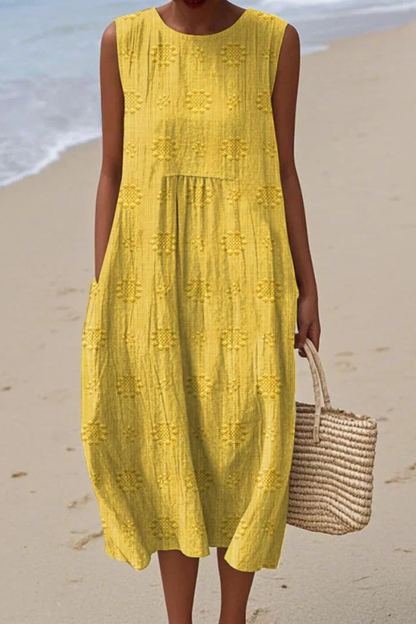 Yellow embroidery midi dress with textured geometric pattern and tiered design