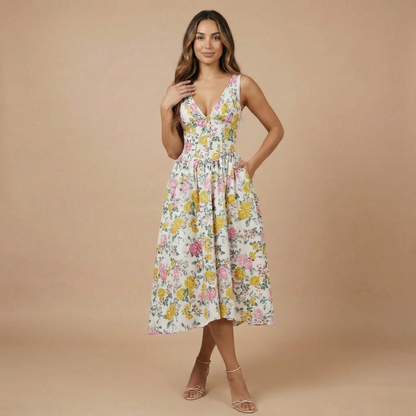 Floral corset midi dress with pink and yellow blooms on cream background