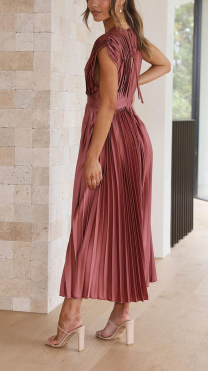 Side view of mauve pleated midi dress showing open back detail