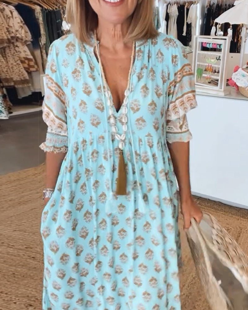 Light blue floral tiered dress front view with V-neckline and lace sleeve detail