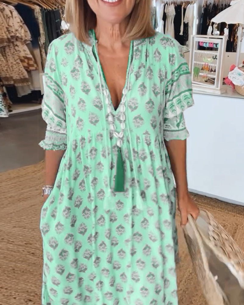 Mint green floral tiered maxi dress with V-neckline and lace trim sleeves