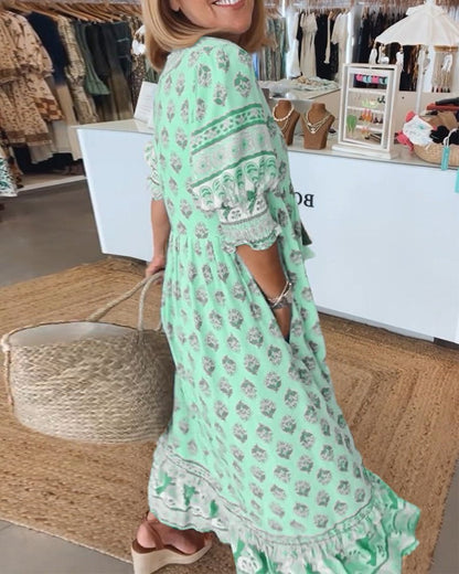Mint green floral tiered dress side view showing layered hem and lace details