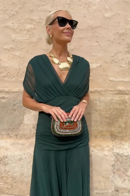 Forest green wrap maxi dress with flowing draped skirt detail