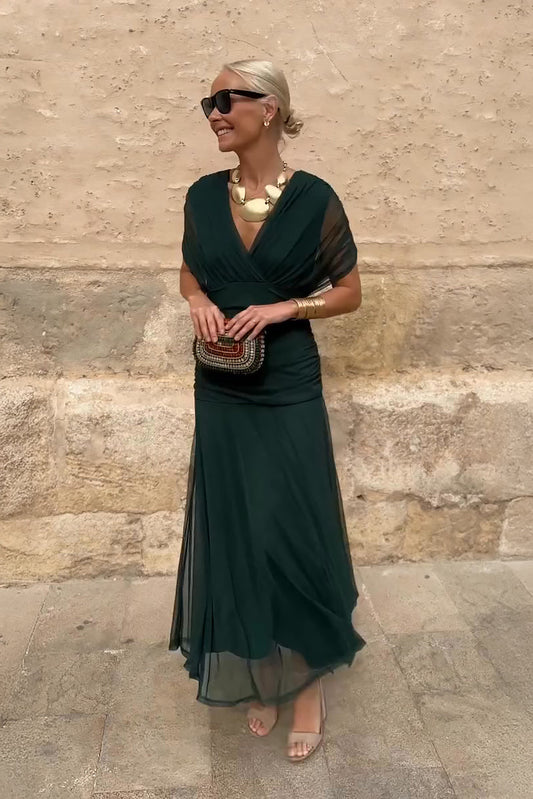 Forest green draped maxi dress with short sleeves and flowing skirt