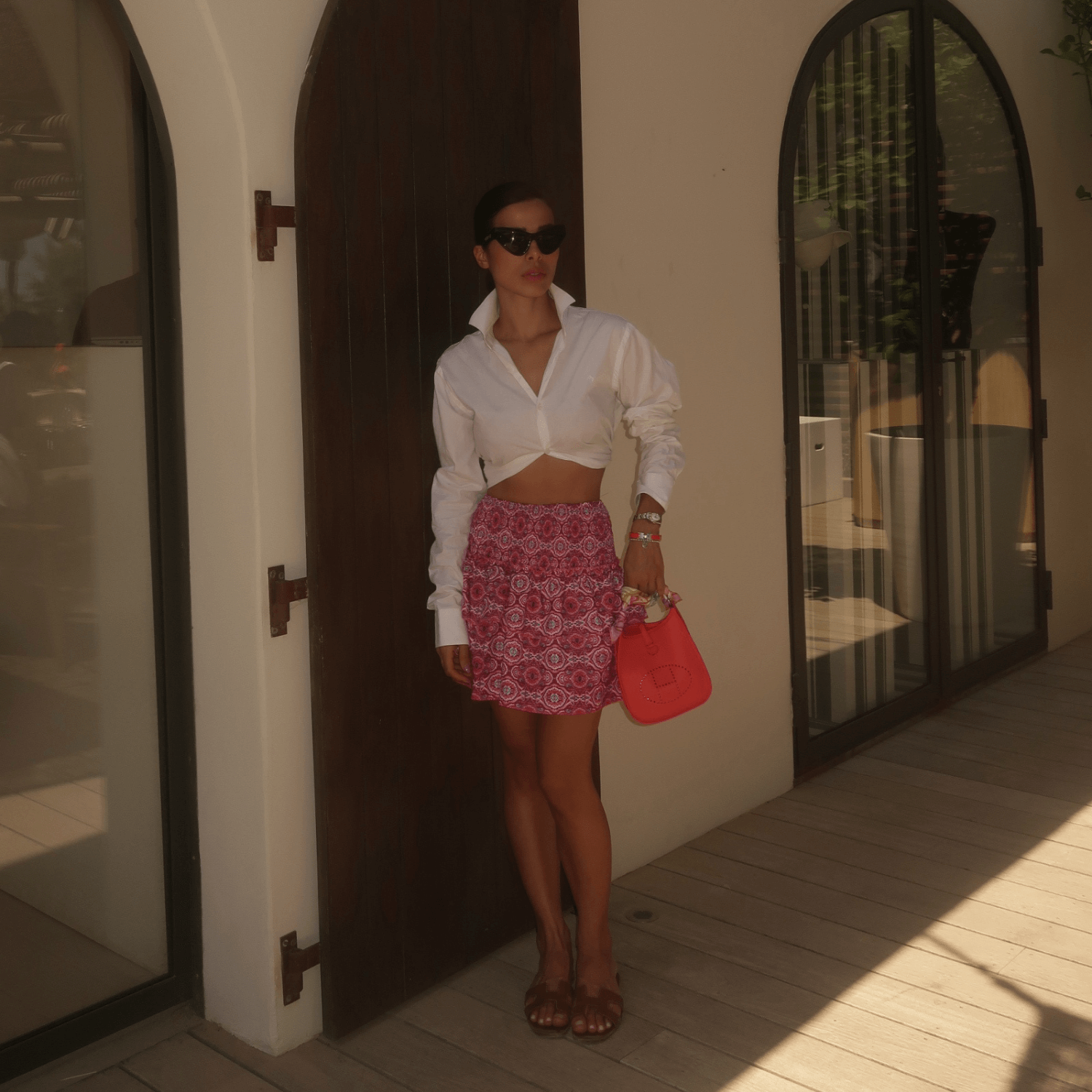 Pink damask ruffle mini skirt styled with white crop top
