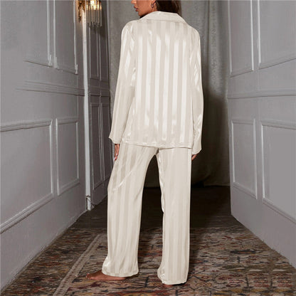 Back view of ivory striped satin pajama shirt displaying vertical stripe texture