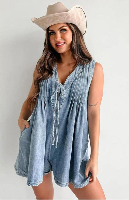 Light blue denim lace-up mini romper with pleated front and tie closure