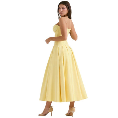 Yellow strapless corset midi dress with pleated skirt, back view