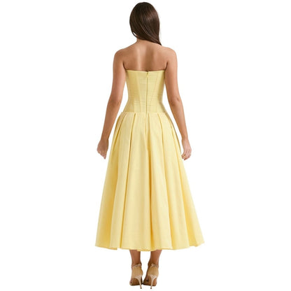 Yellow strapless corset midi dress with structured bodice and full skirt, rear angle