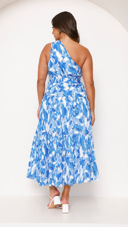 Back view of blue abstract tiered midi dress with layered skirt