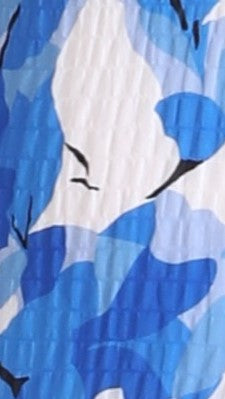 Close-up of blue and white abstract print fabric texture