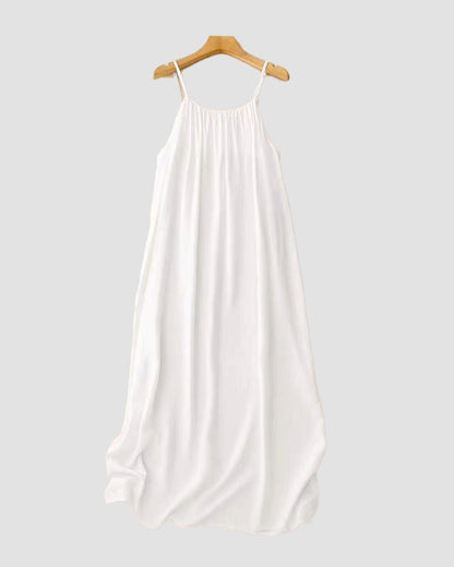 Cream textured maxi dress on wooden hanger with gathered neckline