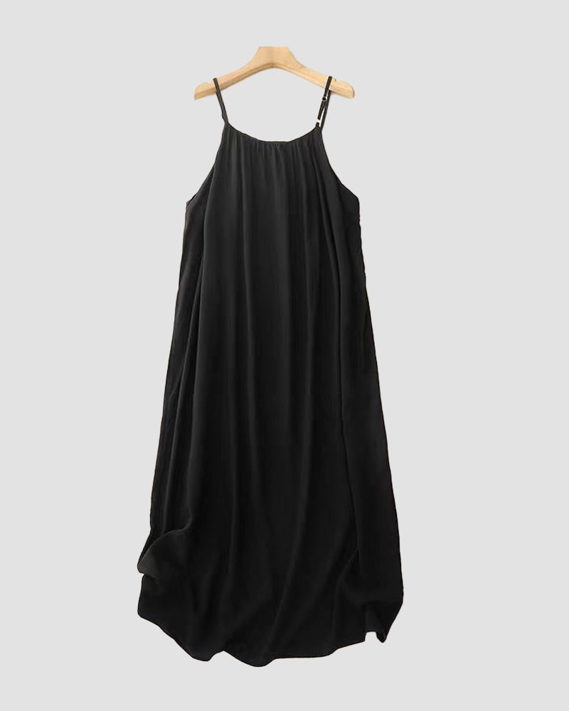 Black backless maxi dress on hanger showing full length and gathered fabric