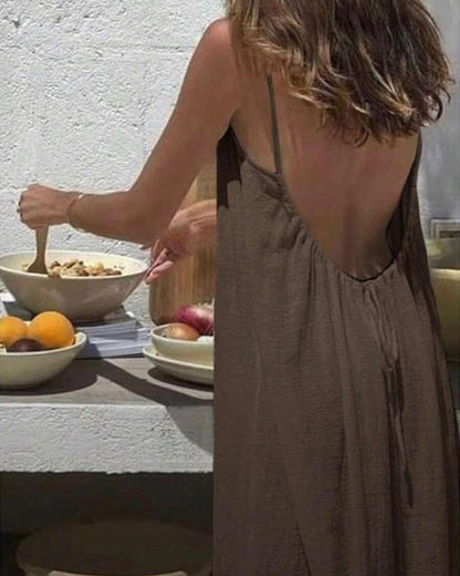 Close-up of taupe maxi dress neckline with pleated bodice detail