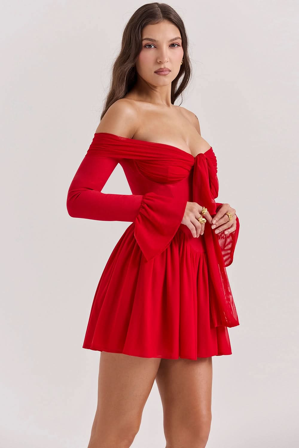 Red bow mini dress side view with long bell sleeves and tie detail
