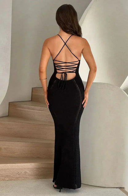 Back view of black maxi dress with lace-up cutout design