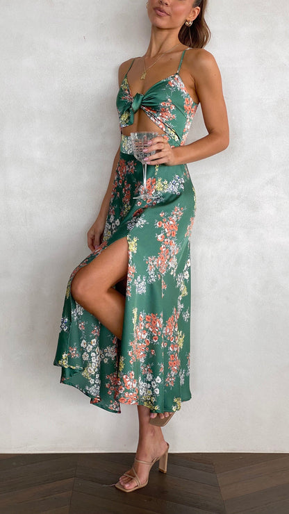 Green floral midi dress with front tie cutout and flowing skirt