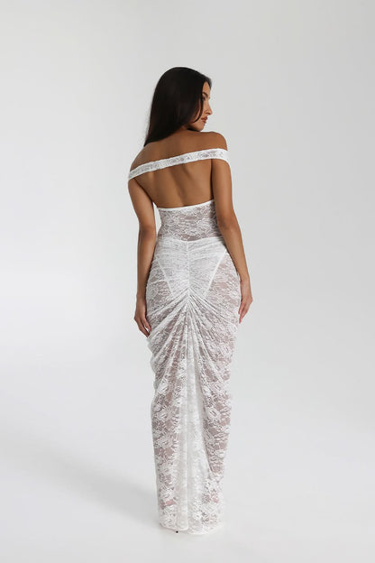 Back view of white lace maxi dress with open back and gathered ruched skirt