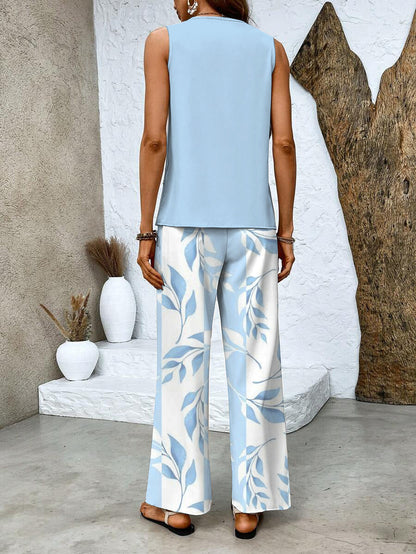 Back view of light blue sleeveless top with blue leaf print wide-leg pants
