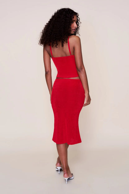 Back view of red ribbed midi set showing open back camisole design