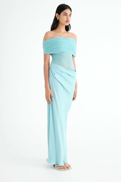 Side view of turquoise ruched maxi dress with off-shoulder neckline
