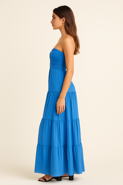Side view of blue strapless tiered maxi dress with fitted ruched bodice