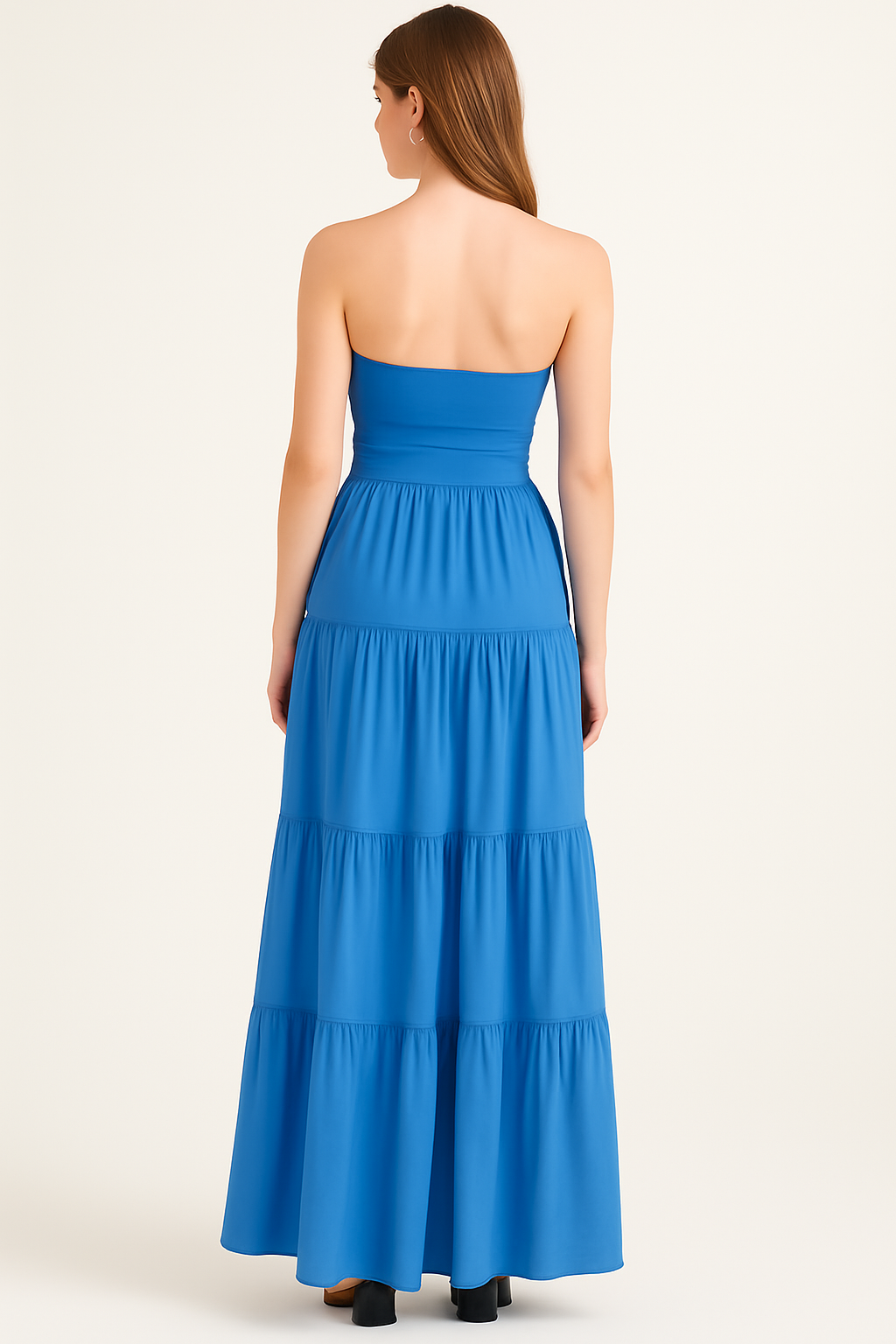 Back view of blue strapless maxi dress showing open back and layered skirt