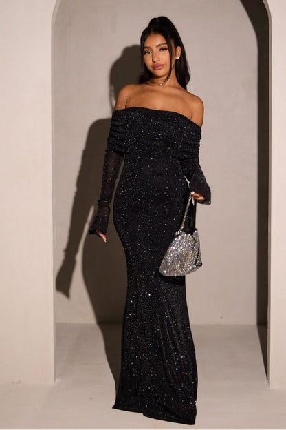 Black sequin off-shoulder maxi dress with long sleeves and fitted silhouette