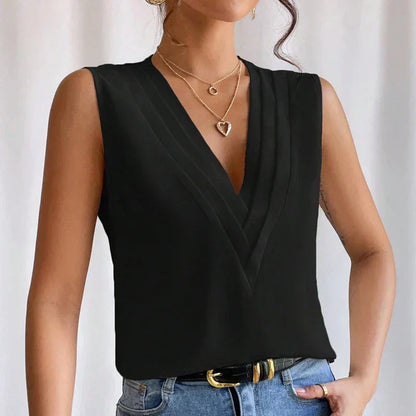 Black sleeveless wrap top with deep V-neckline and draped front