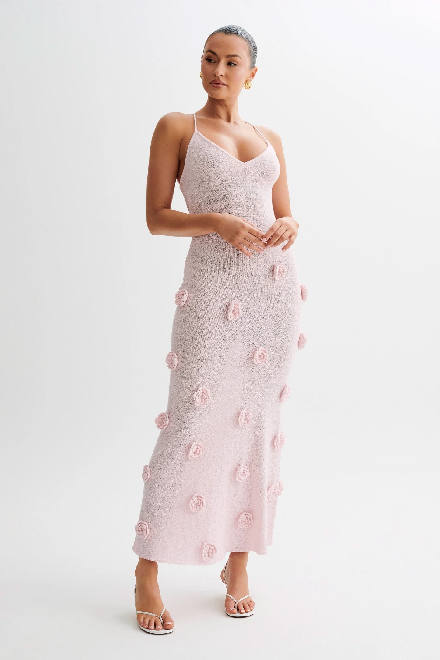 Full-length pink floral maxi dress with textured rose details