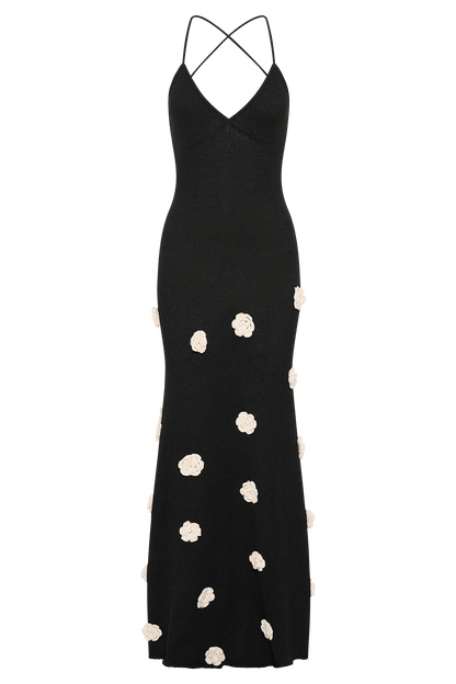 Black maxi dress with cream floral motifs, full-length flat lay