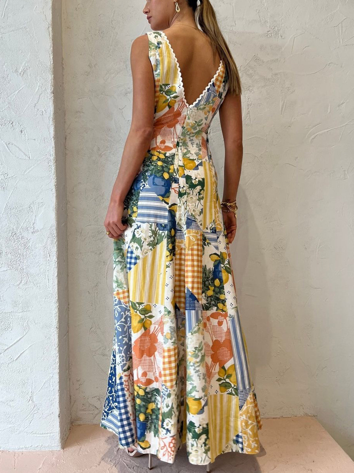 Patchwork maxi dress showing low V-back with scalloped trim and floral details for women