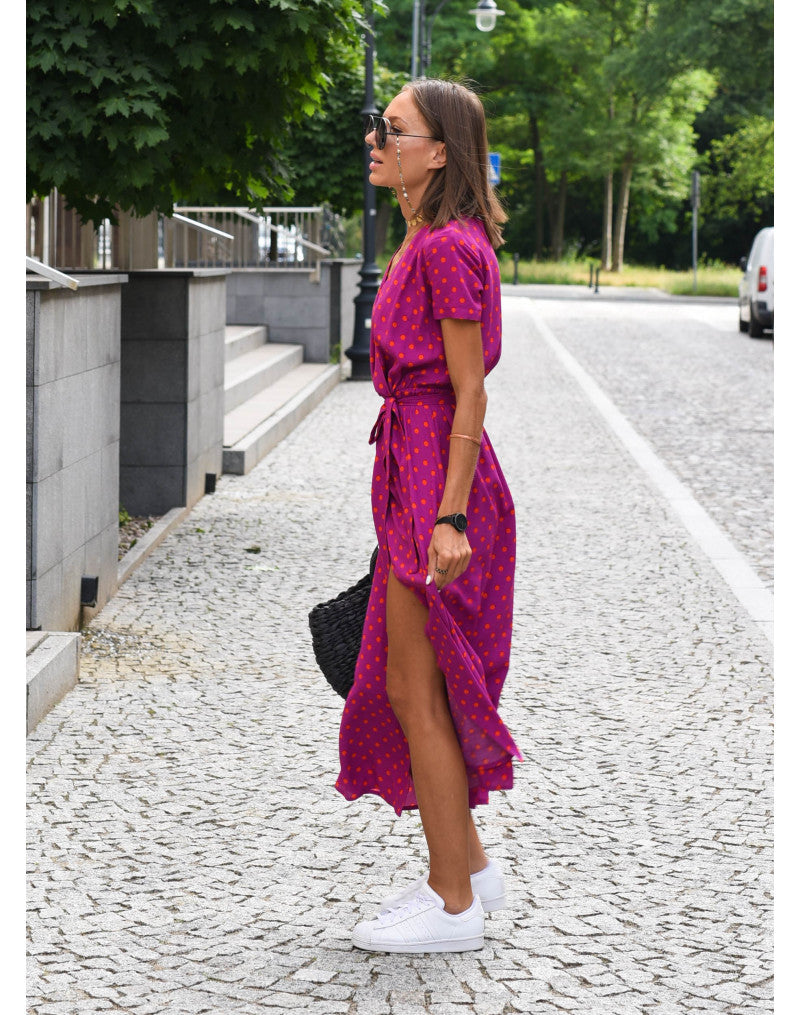Magenta and red polka dot wrap midi dress side profile view