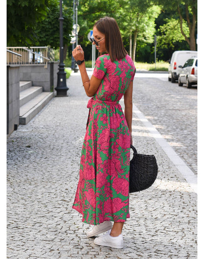 Pink and green floral wrap midi dress back view with tied waist detail