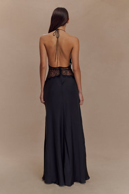 Back view of black maxi dress with lace waist band and halter tie closure