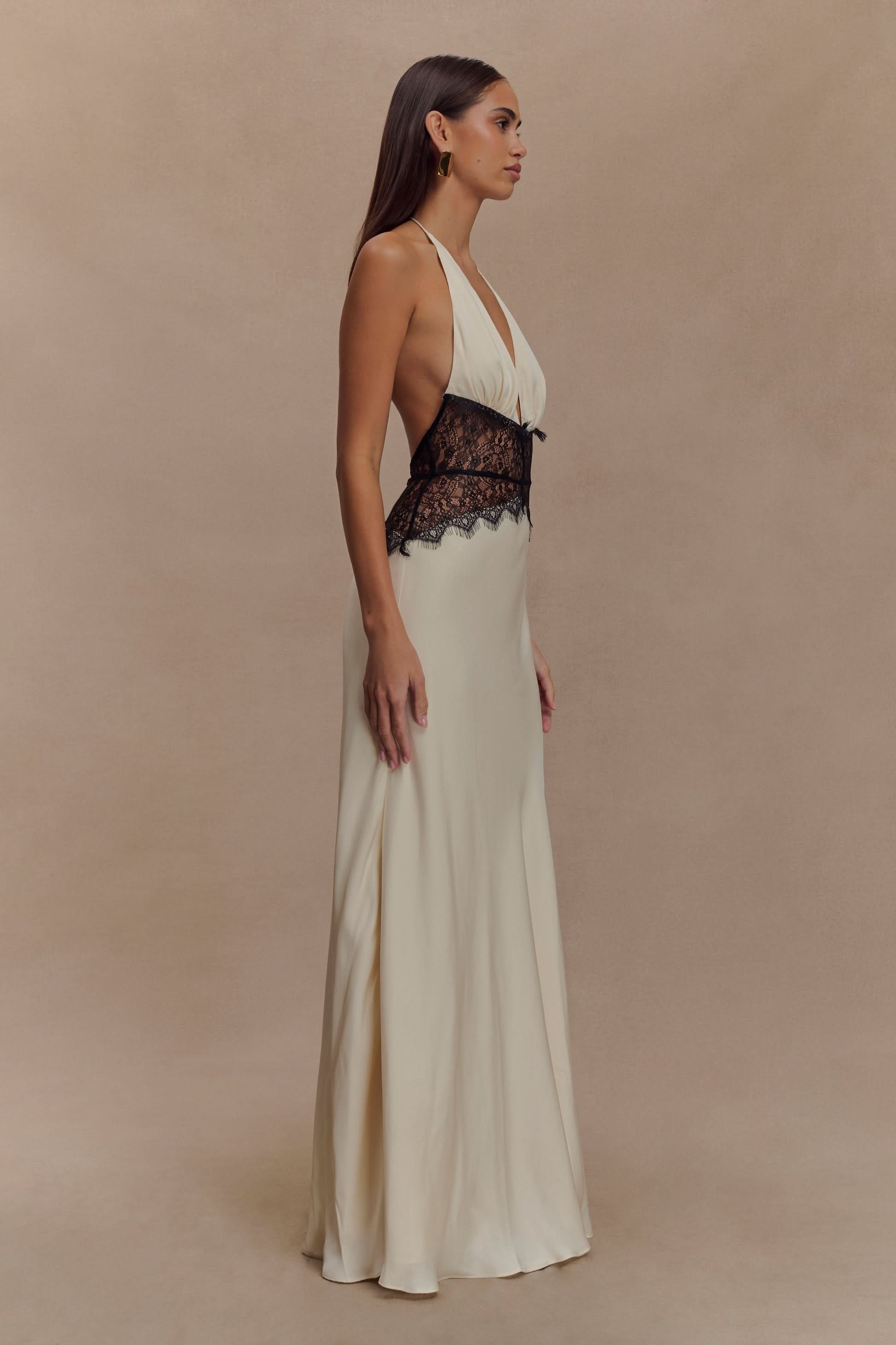 Cream halter maxi dress with black lace waist detail and V-neckline
