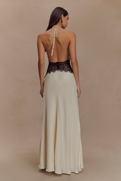 Back view of cream maxi dress with black lace waist and halter tie