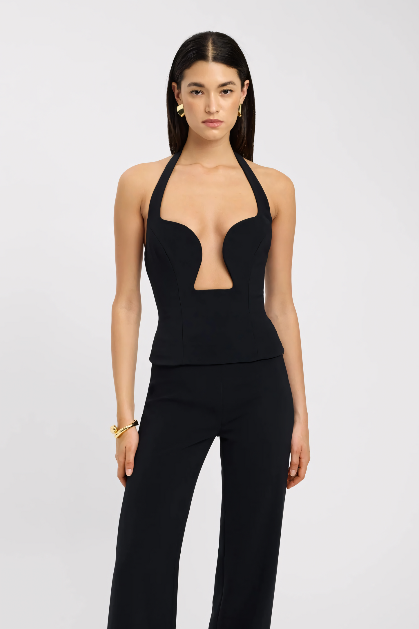 Black sweetheart bustier top with deep plunge cutout and halter neck closure detail for women
